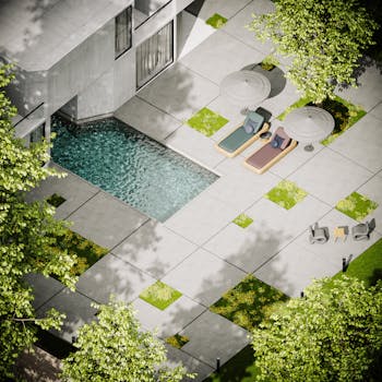 Modern villa with pool, lounge chairs, and patio, surrounded by trees.